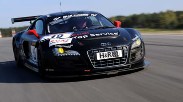 evo races an Audi R8 LMS at the Nurburgring 24 hours
