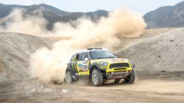 Mini riding the sand dunes on the Dakar rally