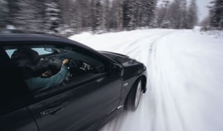 Rallying in the snow in a Mitsubishi Evo IX