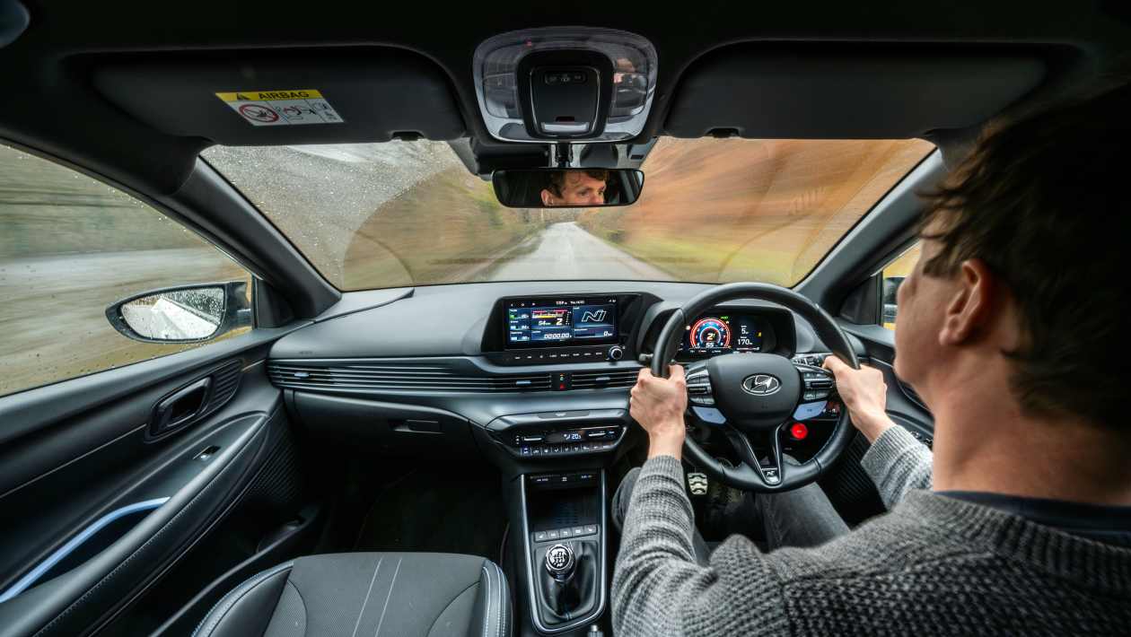 Hyundai i20 N interior dashboard showing digital instrument cluster, touchscreen infotainment, and N-branded steering wheel