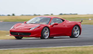 Red Ferrari 458 Italia sliding on track