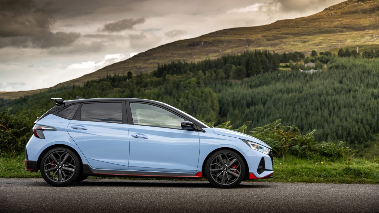Hyundai i20 N profile view on Welsh country road, showing compact proportions and rally-inspired stance