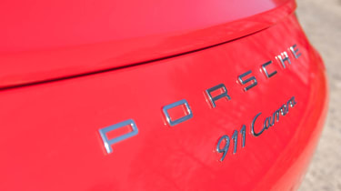2012 Porsche 911 Carrera manual badge