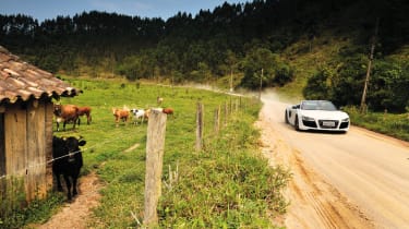 Audi R8 V10 Spider driving on dirt road