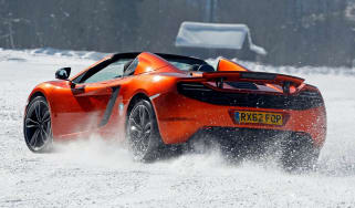 McLaren MP4-12C Spider orange on snow
