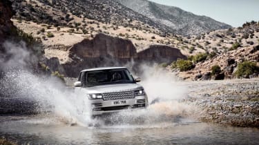 2013 Range Rover front silver driving through river